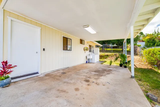 a view of a big room with windows and entryway
