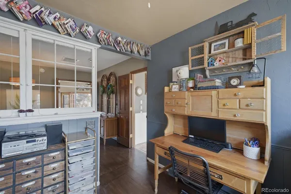 a spacious bedroom with a bed and glass walk in closet