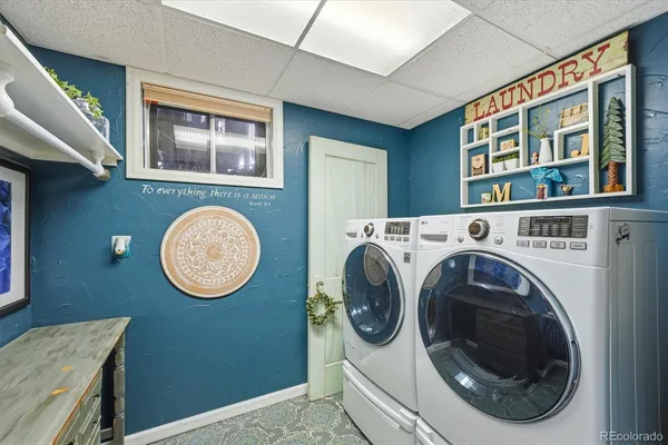 a view of a livingroom with furniture and a large window