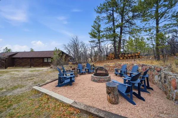 a view of a patio with table and chairs and wooden floor