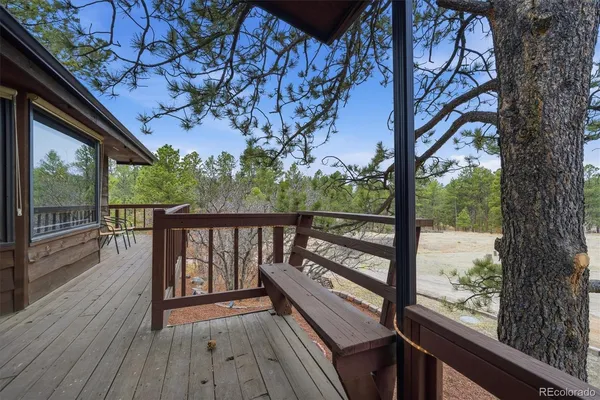 a view of balcony with wooden floor