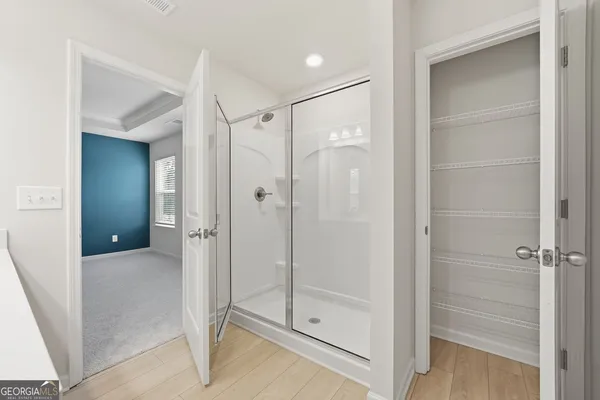 a bathroom with a sink double vanity and a mirror