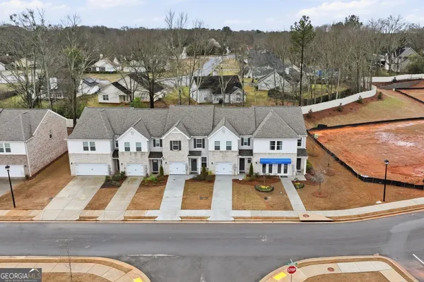 an aerial view of a house with a ocean view