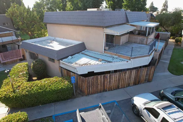 an aerial view of a houses with outdoor space