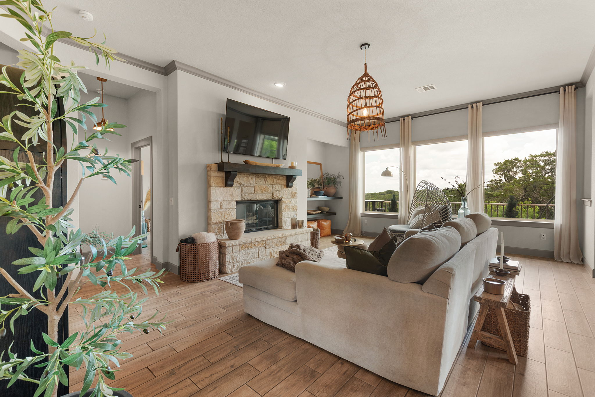 155 Balcones Ridge Way Bertram, TX 78605 - Photo 18 of 37 A spacious living area with stone fireplace invites comfortable gatherings.