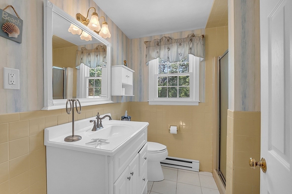 89 Kingswear Circle Dennis, MA 02660 - Photo 12 of 40 a bathroom with a sink a toilet and shower