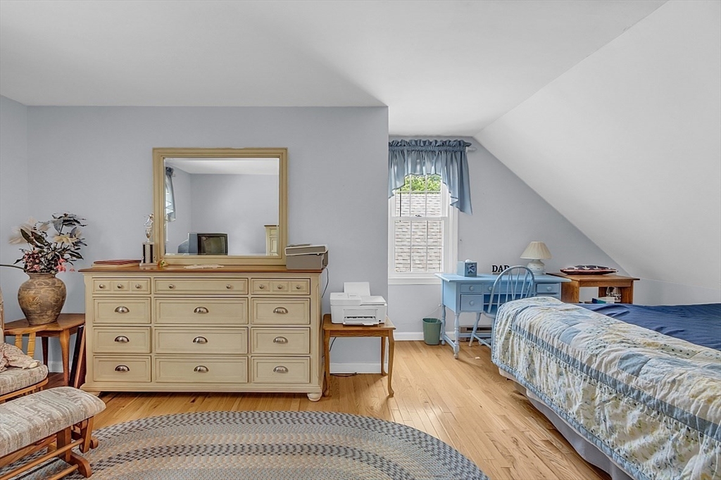 89 Kingswear Circle Dennis, MA 02660 - Photo 13 of 40 a bedroom with a bed a dresser and next to a window