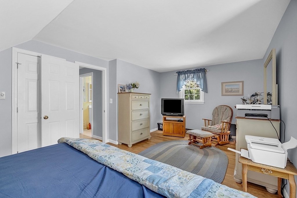 89 Kingswear Circle Dennis, MA 02660 - Photo 14 of 40 a workspace with furniture and a flat screen tv