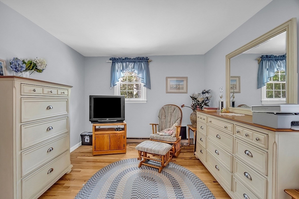 89 Kingswear Circle Dennis, MA 02660 - Photo 15 of 40 a living room with furniture and a flat screen tv
