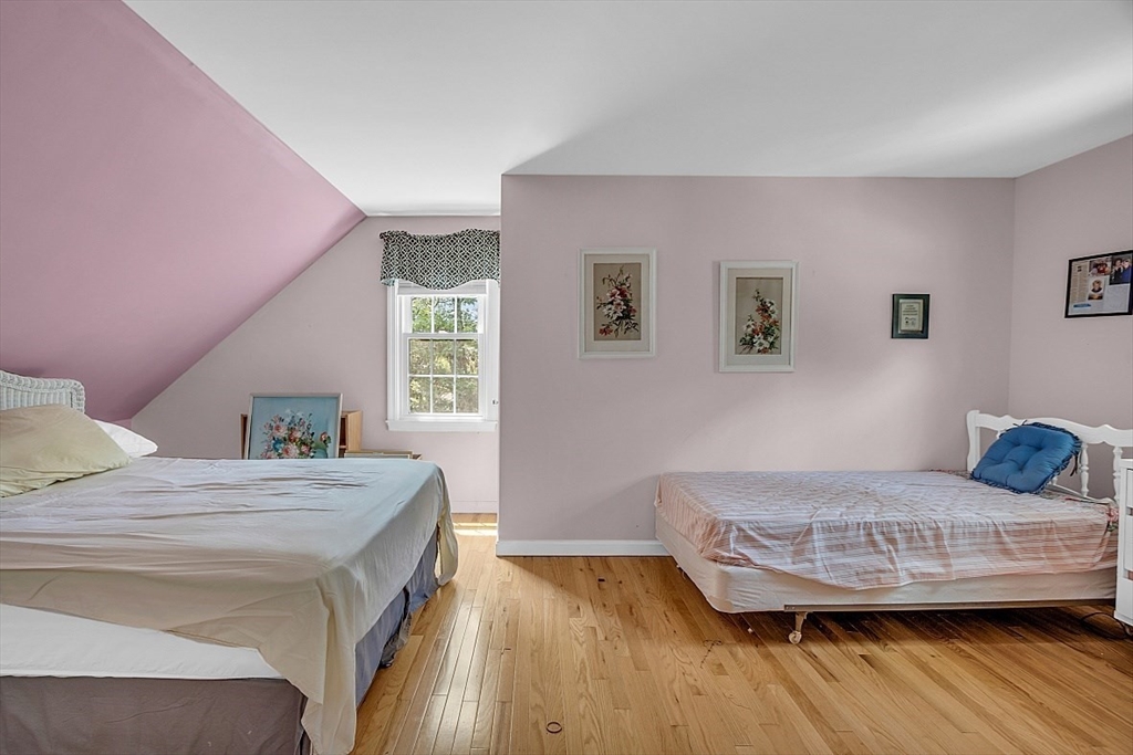 89 Kingswear Circle Dennis, MA 02660 - Photo 16 of 40 a bedroom with a bed and wooden floor