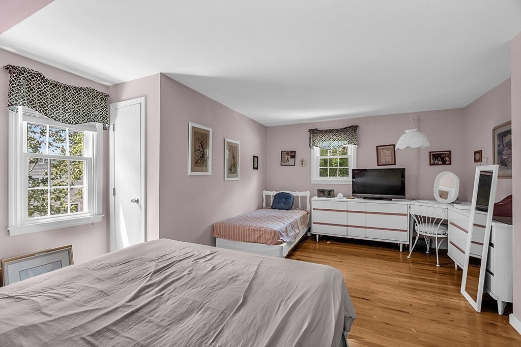 89 Kingswear Circle Dennis, MA 02660 - Photo 17 of 40 a bedroom with a bed and a flat screen tv