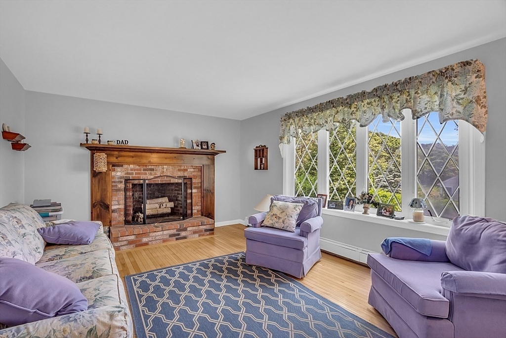 89 Kingswear Circle Dennis, MA 02660 - Photo 20 of 40 a living room with furniture and a fireplace