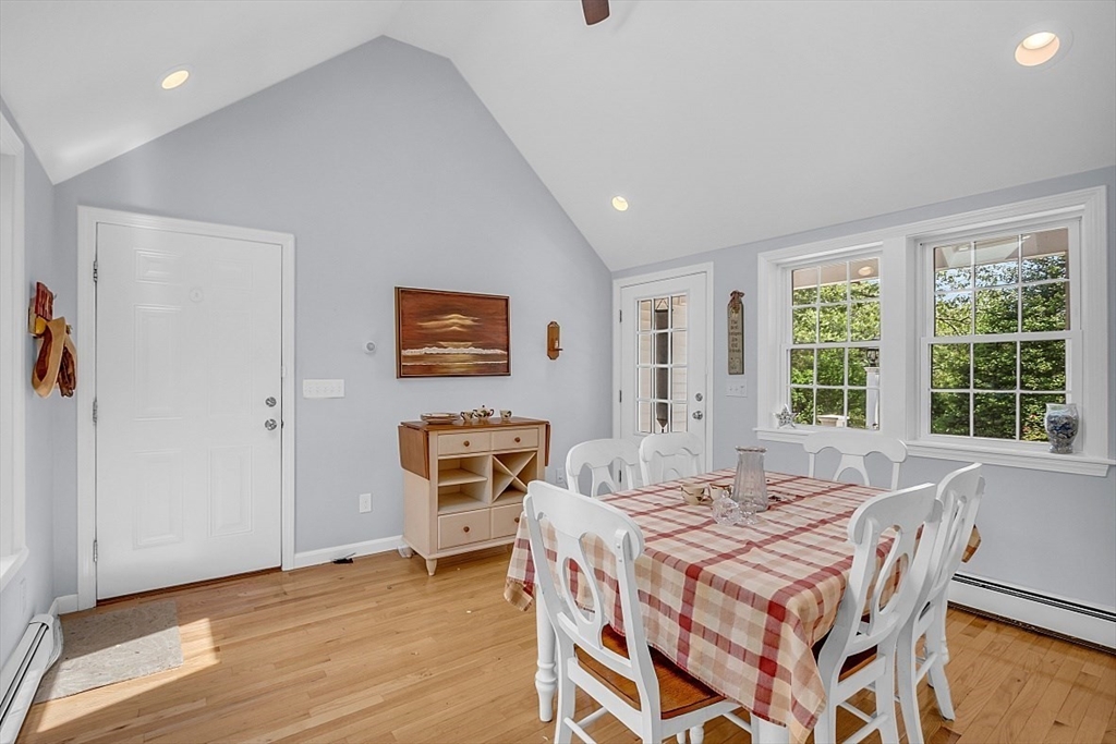 89 Kingswear Circle Dennis, MA 02660 - Photo 26 of 40 a dining room with a table and chairs