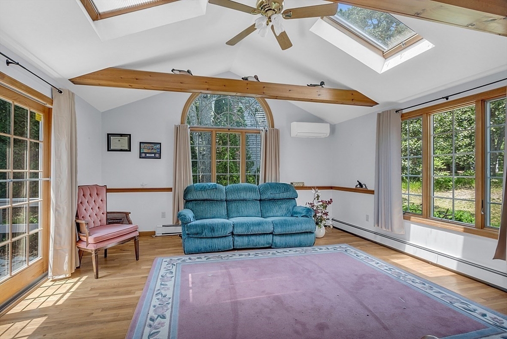 89 Kingswear Circle Dennis, MA 02660 - Photo 31 of 40 a living room with furniture and a large window
