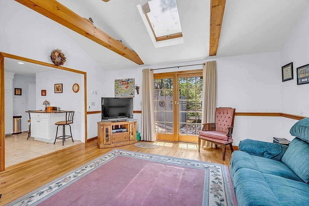 89 Kingswear Circle Dennis, MA 02660 - Photo 32 of 40 a living room with furniture and a flat screen tv