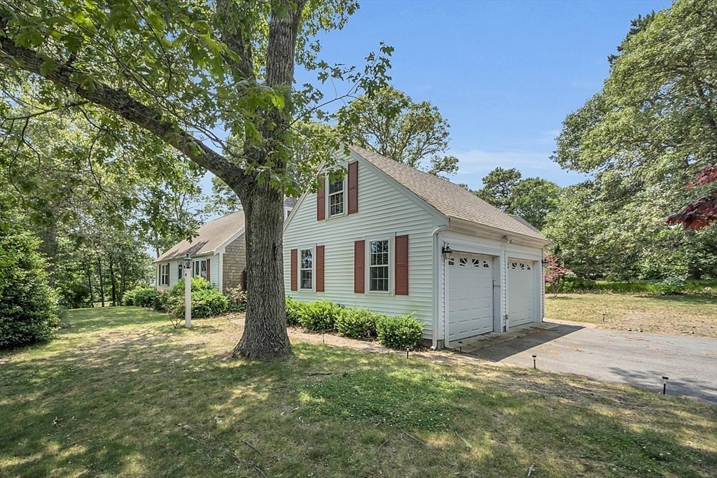 89 Kingswear Circle Dennis, MA 02660 - Photo 10 of 40 a view of backyard of house with green space