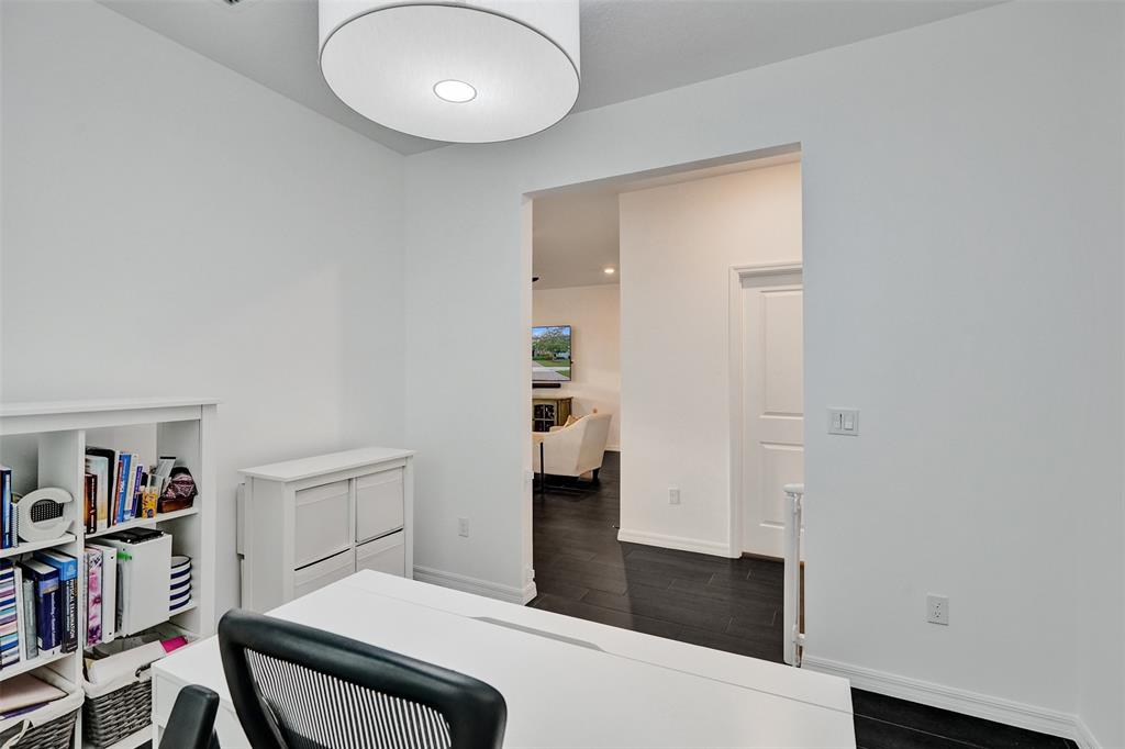 1612 Trailhead Terrace Hollywood, FL 33021 - Photo 22 of 71 a bedroom with a bed and a book shelf