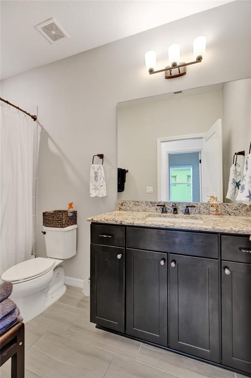 1612 Trailhead Terrace Hollywood, FL 33021 - Photo 41 of 71 a bathroom with a granite countertop toilet sink and mirror