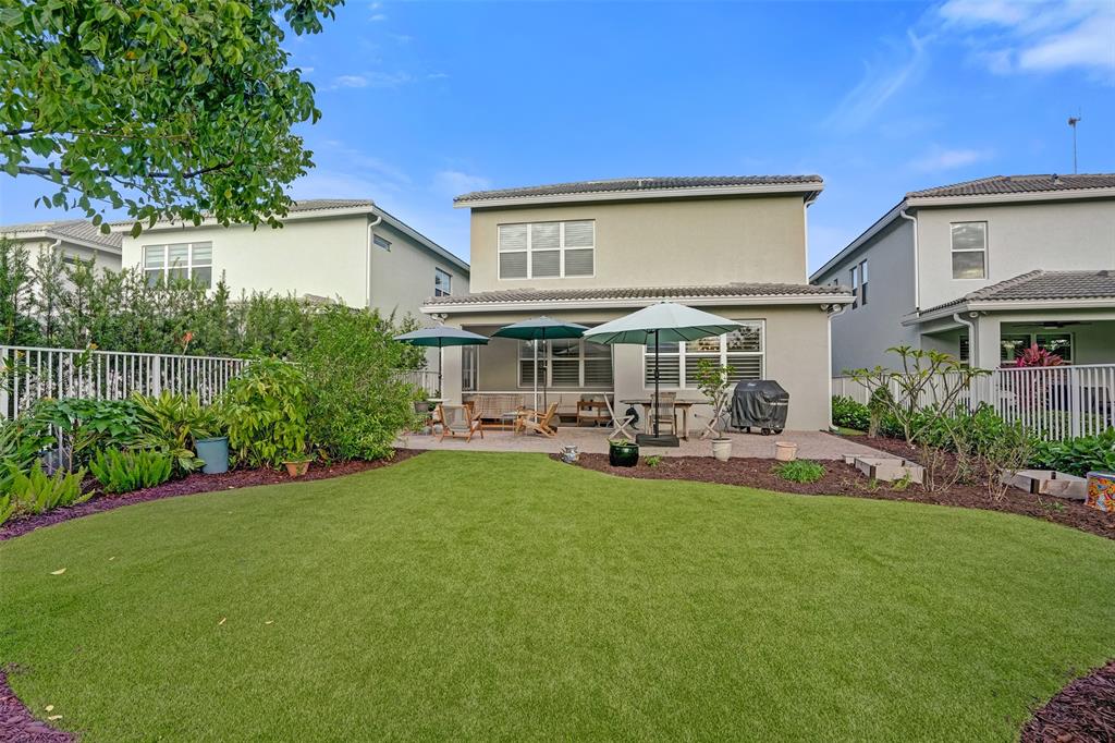1612 Trailhead Terrace Hollywood, FL 33021 - Photo 62 of 71 a view of a house with backyard sitting area and garden