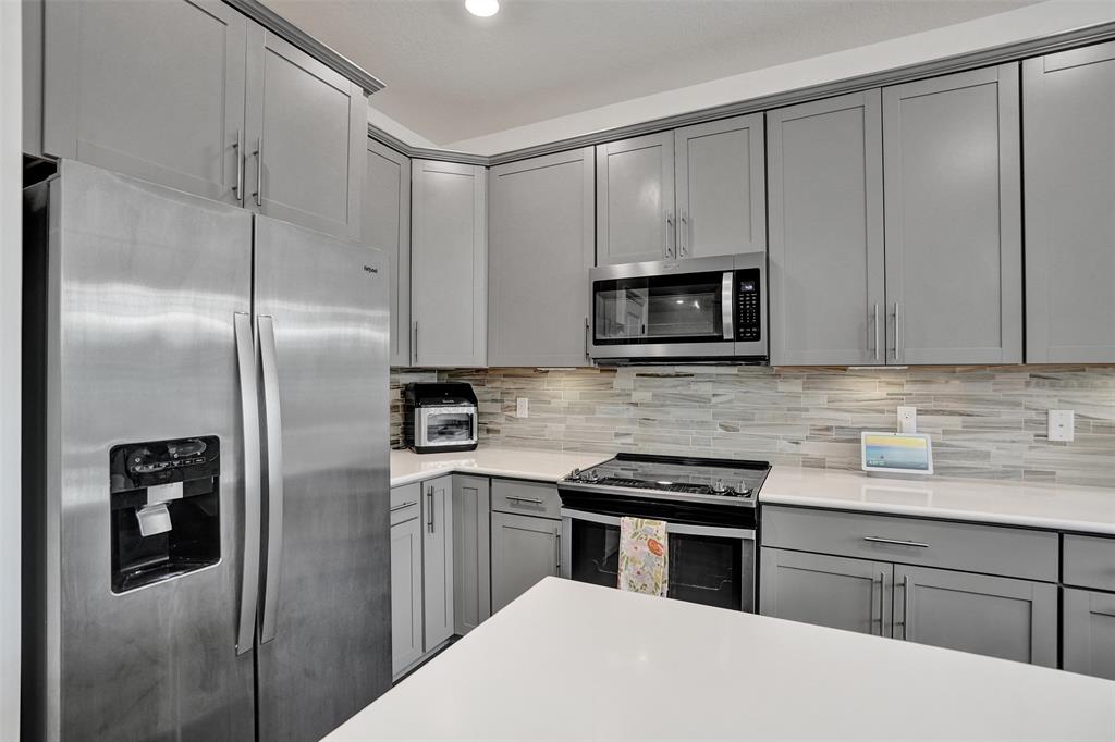 1612 Trailhead Terrace Hollywood, FL 33021 - Photo 8 of 71 a kitchen with a refrigerator stove and microwave