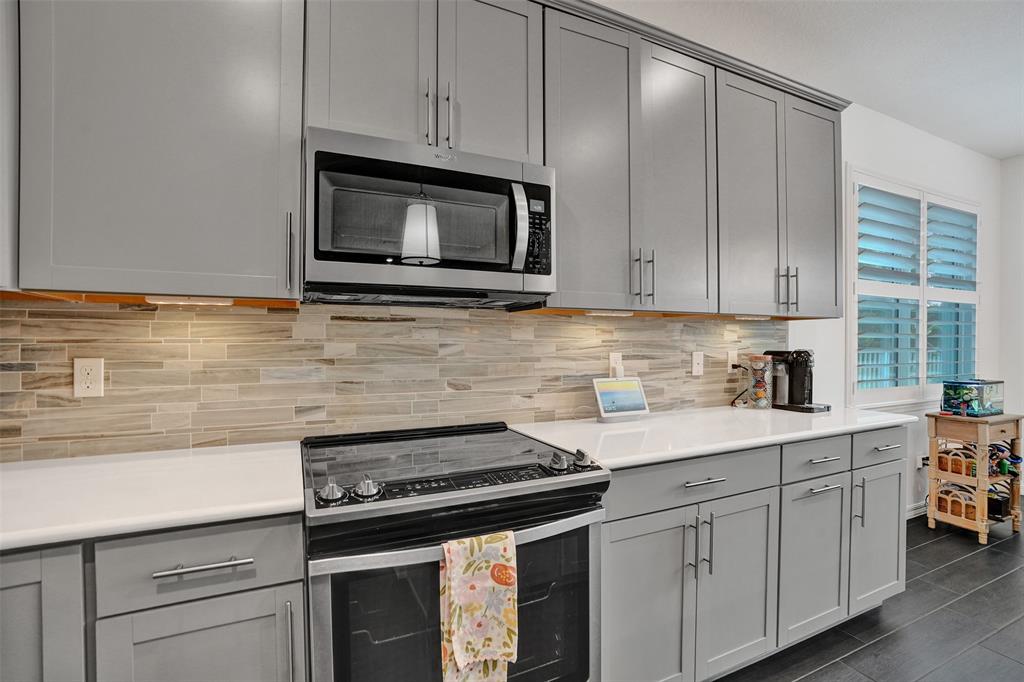 1612 Trailhead Terrace Hollywood, FL 33021 - Photo 9 of 71 a kitchen with cabinets stainless steel appliances and a sink