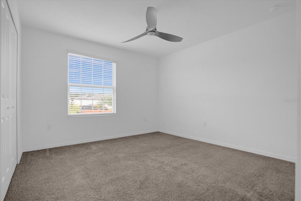 4712 Magnetite Loop Mount Mount Dora, FL 32757 - Photo 8 of 15 an empty room with a window
