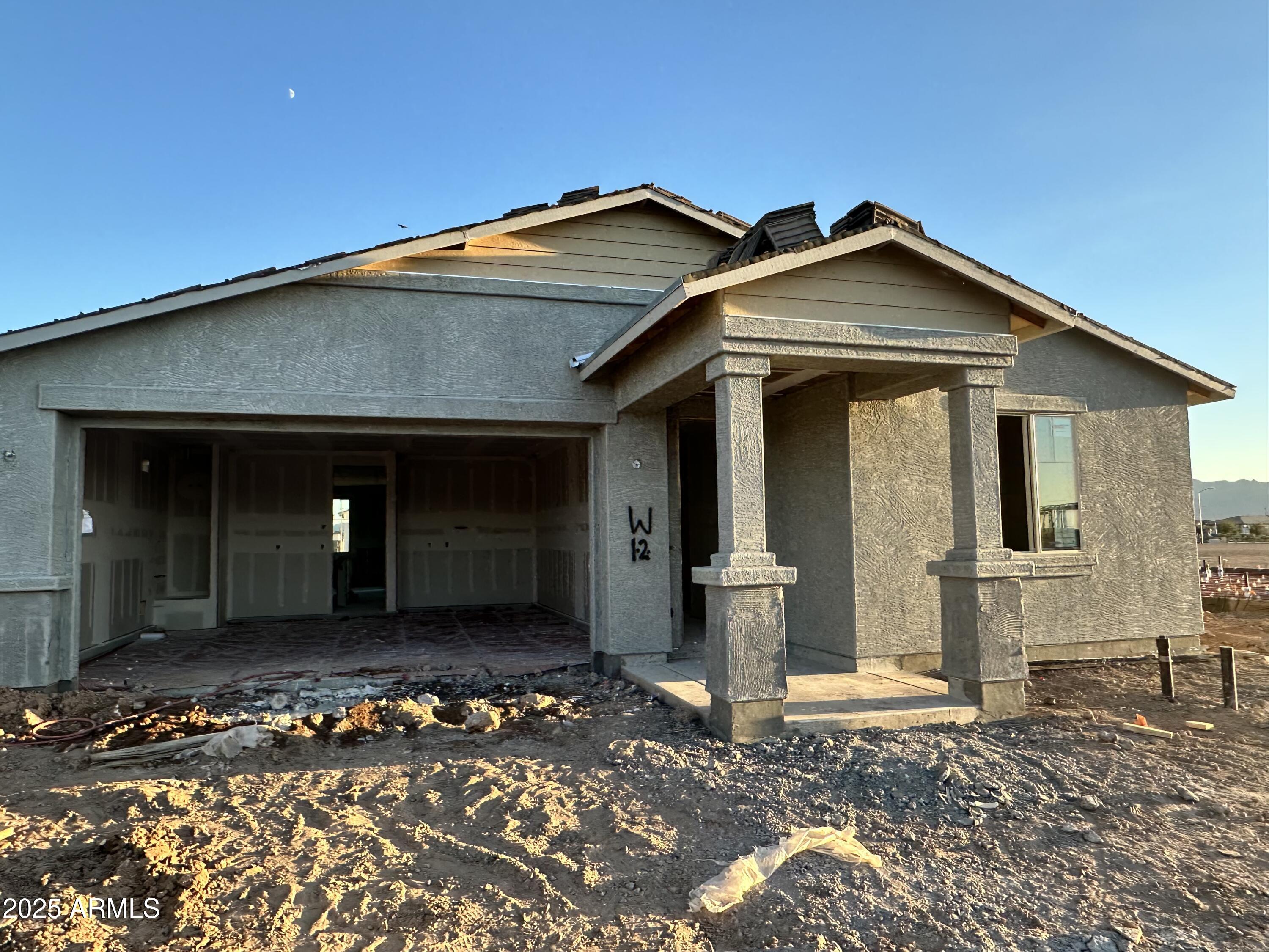 5527 West Piedmont Road Laveen, AZ 85339 - Photo 3 of 22 a front view of a house with a yard
