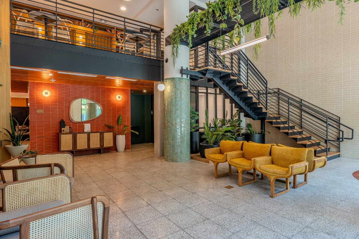 1701 Simond Avenue, Unit 201 Austin, TX 78723 - Photo 2 of 19 The building lobby is beautifully decorated and it features a mezzanine with seating areas for meetings
