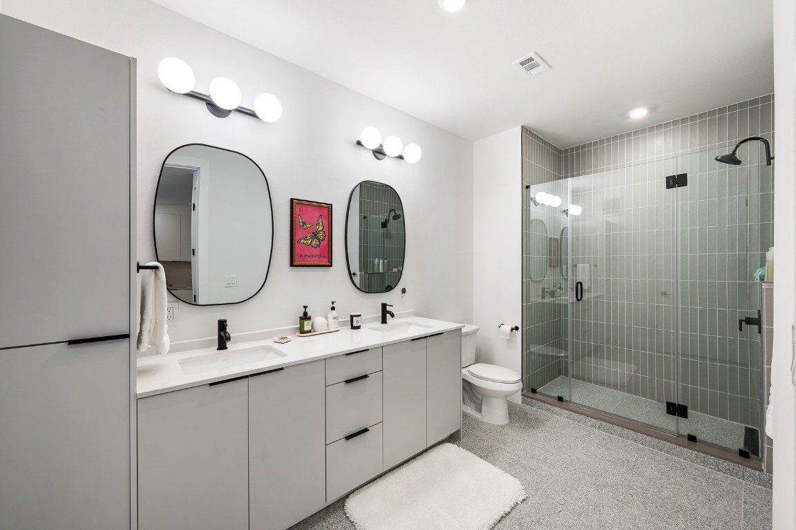 1701 Simond Avenue, Unit 201 Austin, TX 78723 - Photo 7 of 19 Very spacious bathroom with his/her sinks and a spacious walk in shower