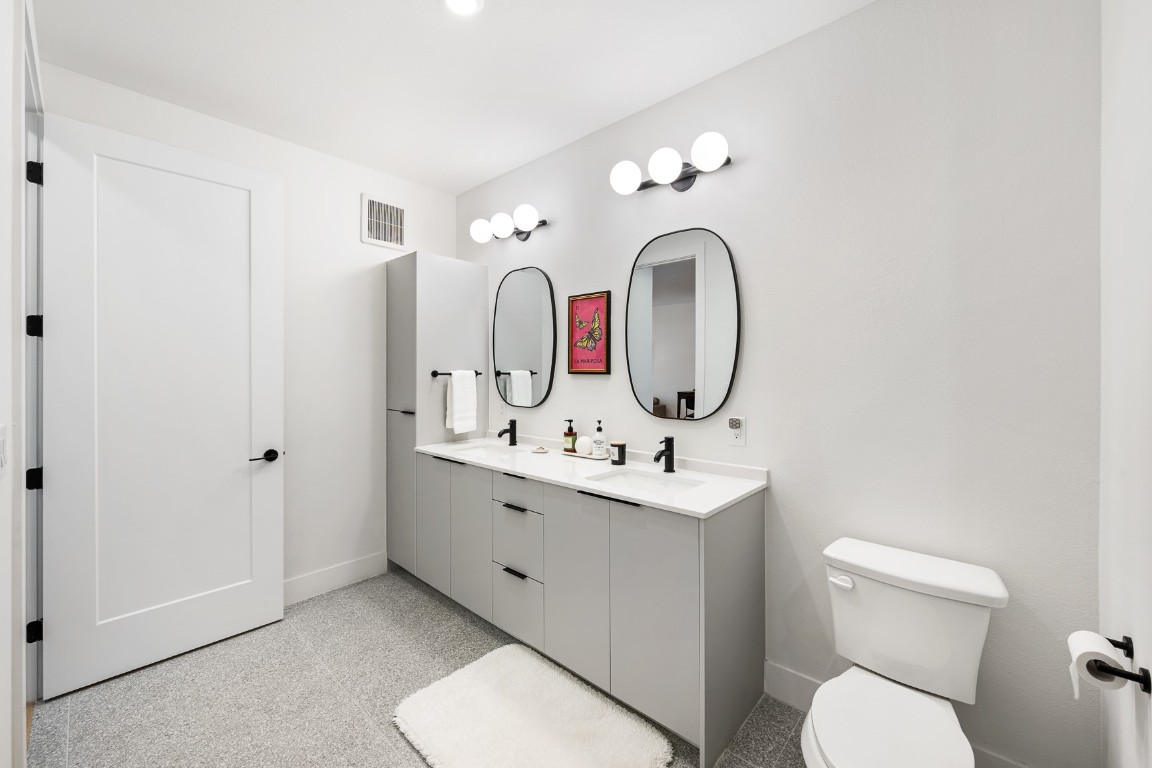 1701 Simond Avenue, Unit 201 Austin, TX 78723 - Photo 8 of 19 There is plenty of storage in the bathroom