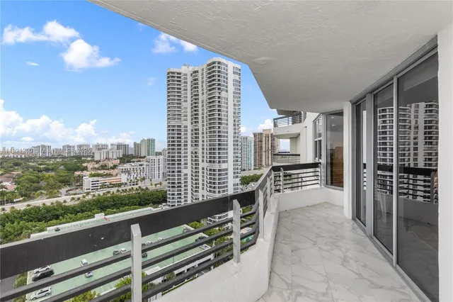 a view of building with yard and staircase