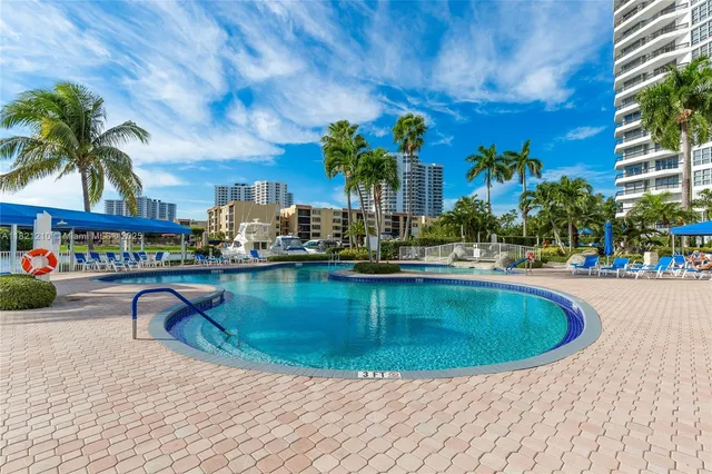 a view of a swimming pool with a lounge chairs