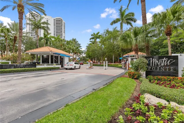 a sign that is sitting in front of flowers