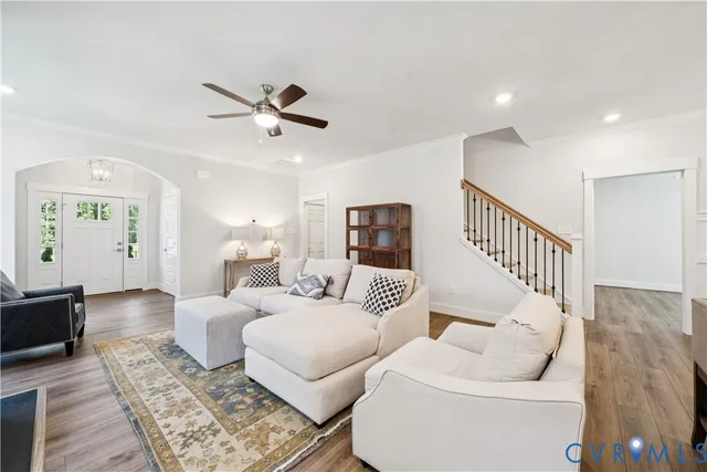 a living room with furniture and a rug