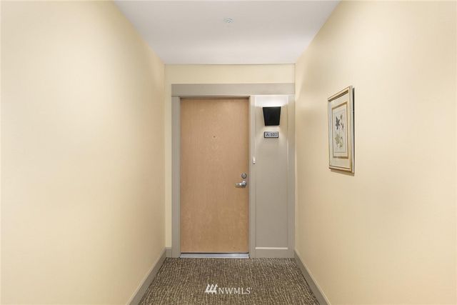 a view of hallway with closet