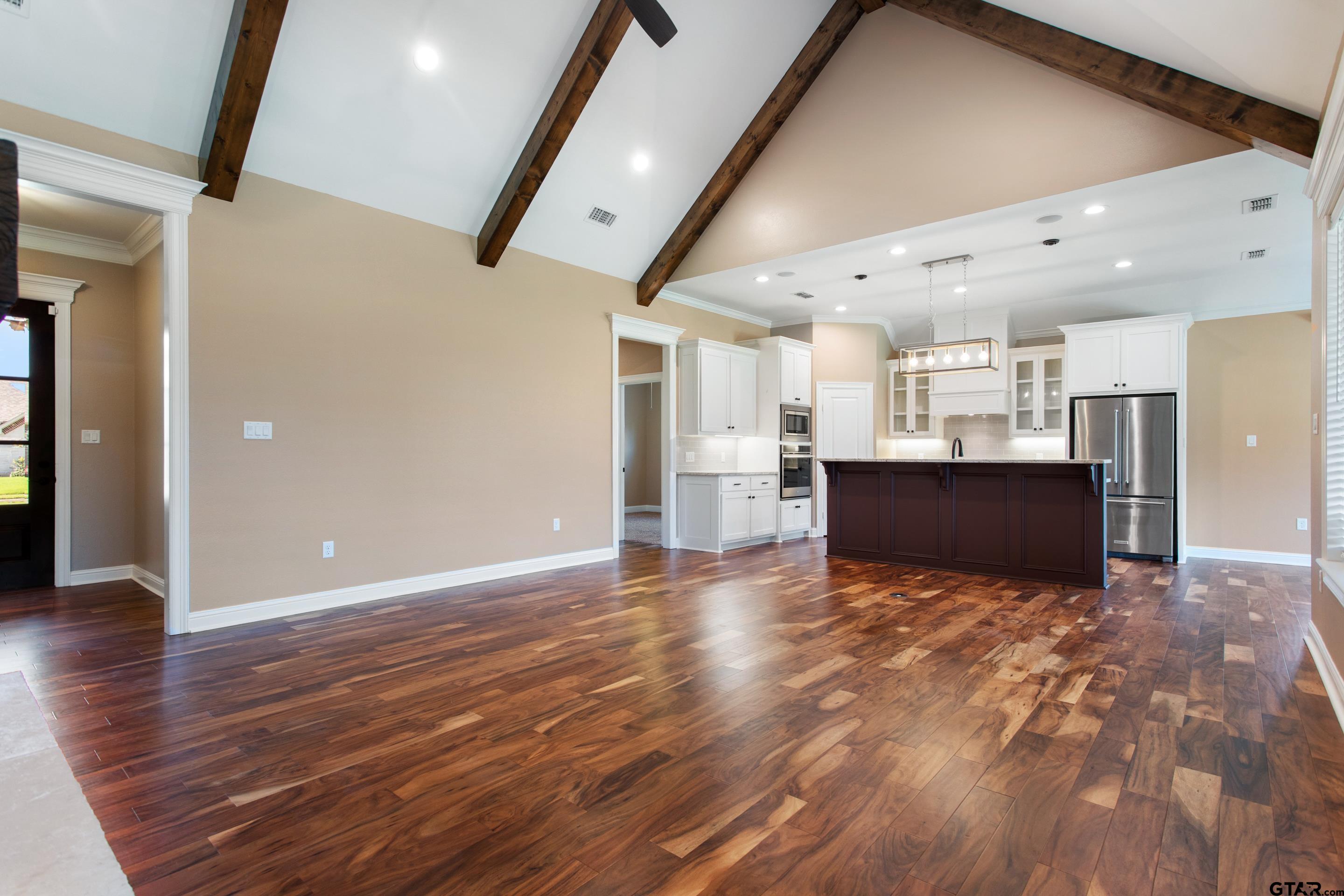 105 Nathan Road Chandler, TX 75758 - Photo 6 of 36 a view of kitchen and hall with wooden floor