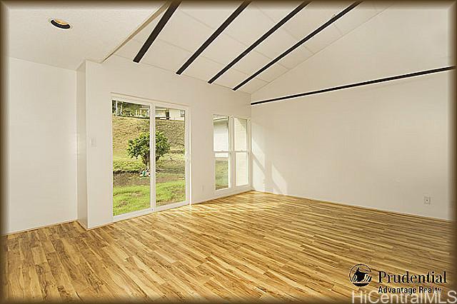 544 Kuliouou Road Honolulu, HI 96821 - Photo 1 of 1 a view of a bedroom with wooden floor and a bed