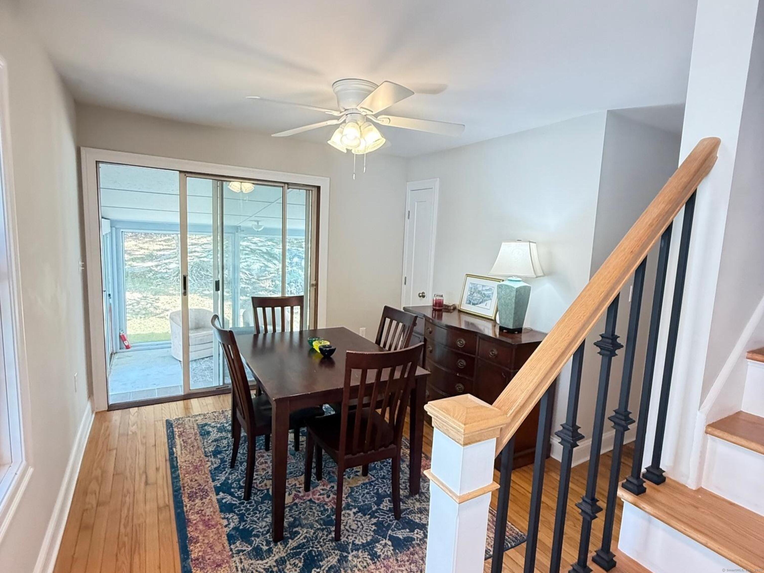 152 Hewitt Road Stonington, CT 06355 - Photo 12 of 34 a view of a dining room with furniture and wooden floor