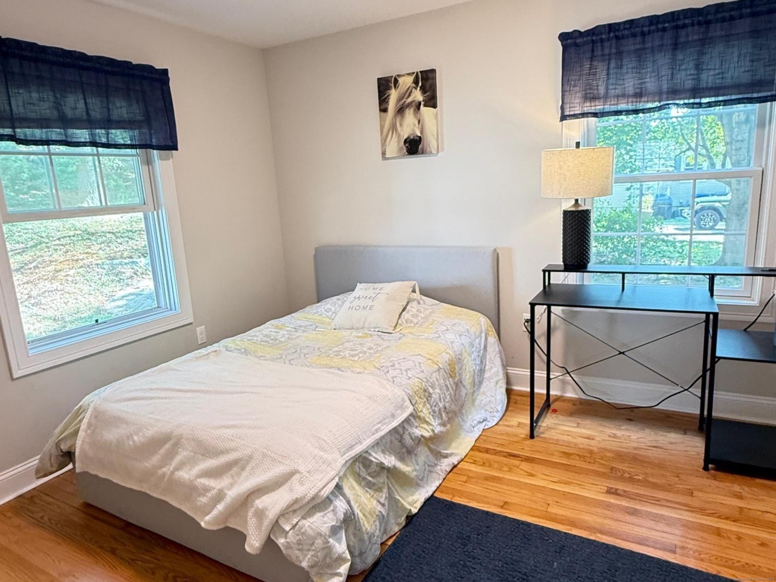 152 Hewitt Road Stonington, CT 06355 - Photo 16 of 34 a bedroom with a bed and a window