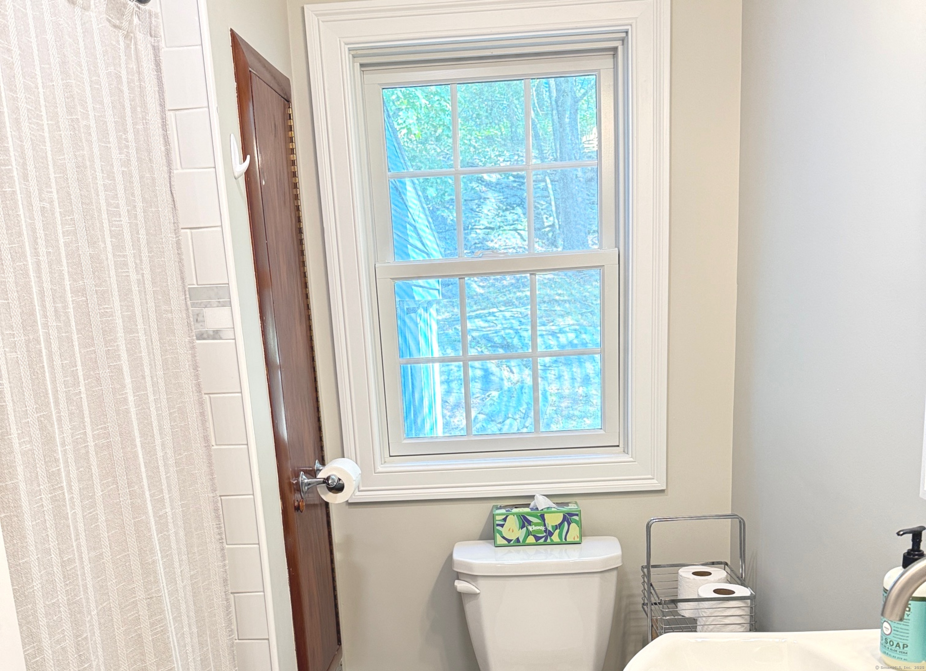 152 Hewitt Road Stonington, CT 06355 - Photo 18 of 34 a bathroom with a toilet and a sink