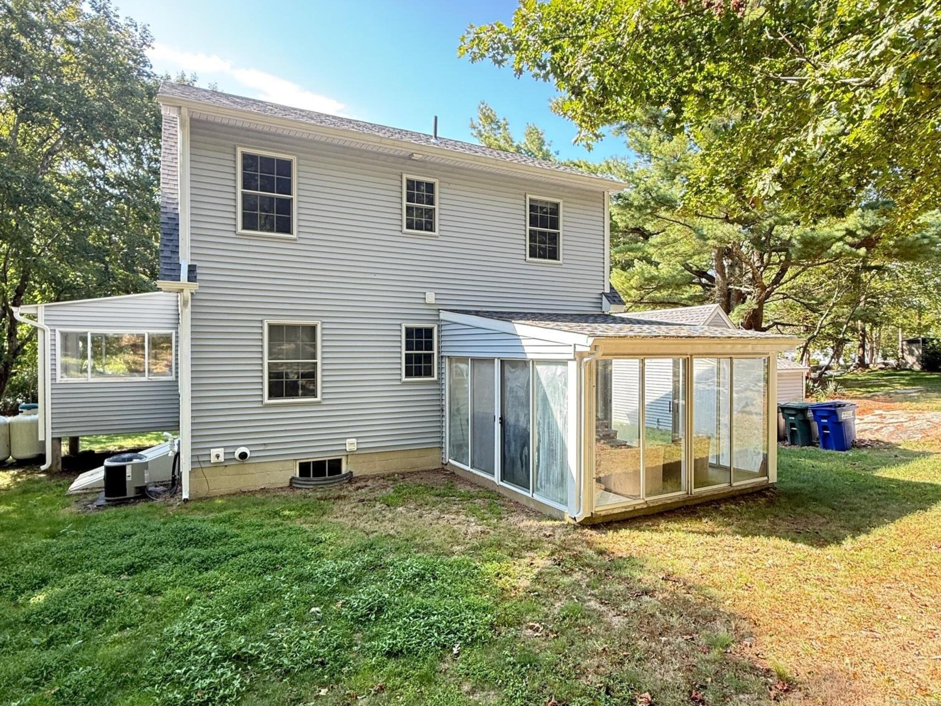 152 Hewitt Road Stonington, CT 06355 - Photo 31 of 34 a view of a house with backyard and a tree