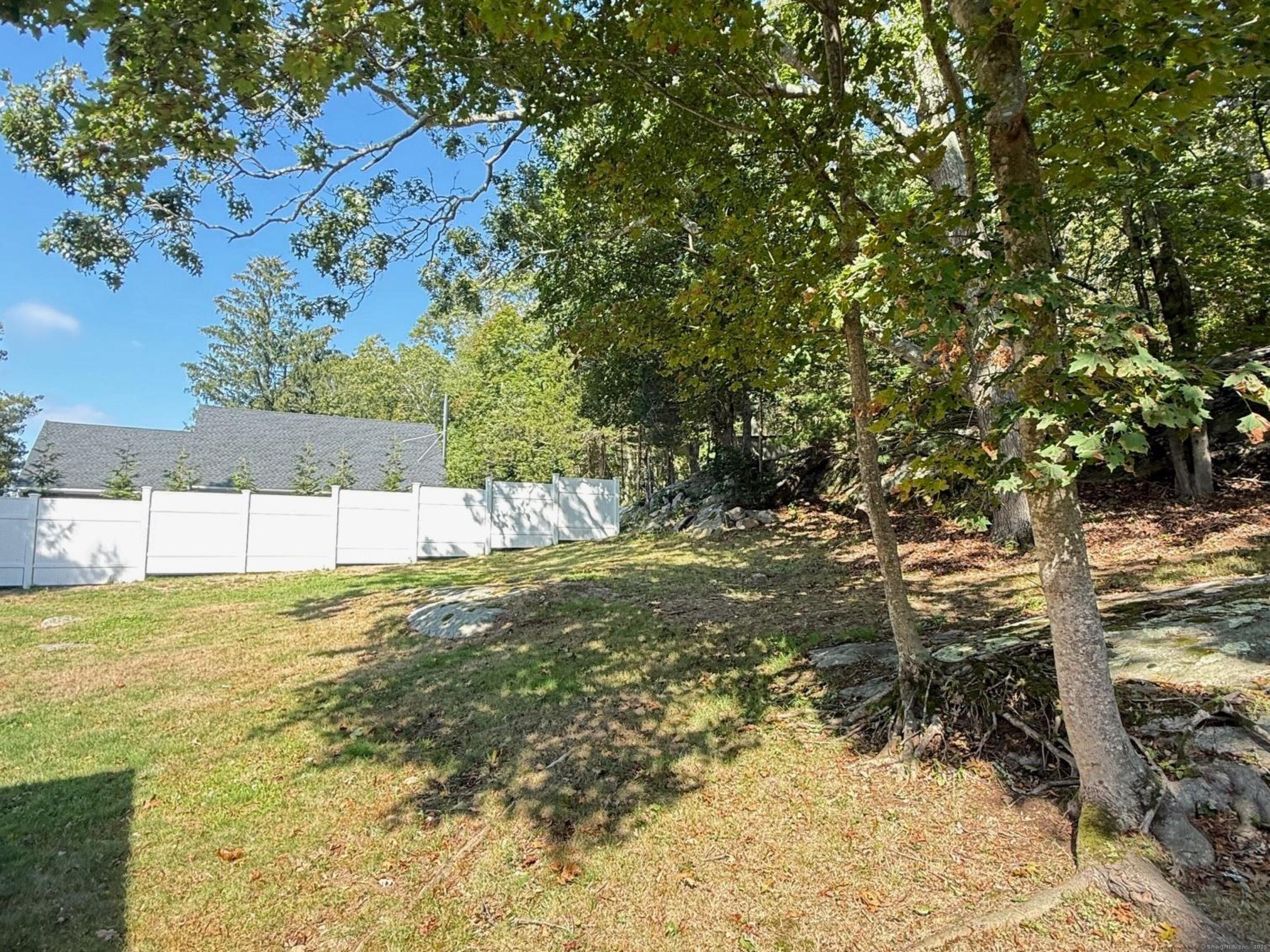 152 Hewitt Road Stonington, CT 06355 - Photo 32 of 34 a view of a yard with an trees