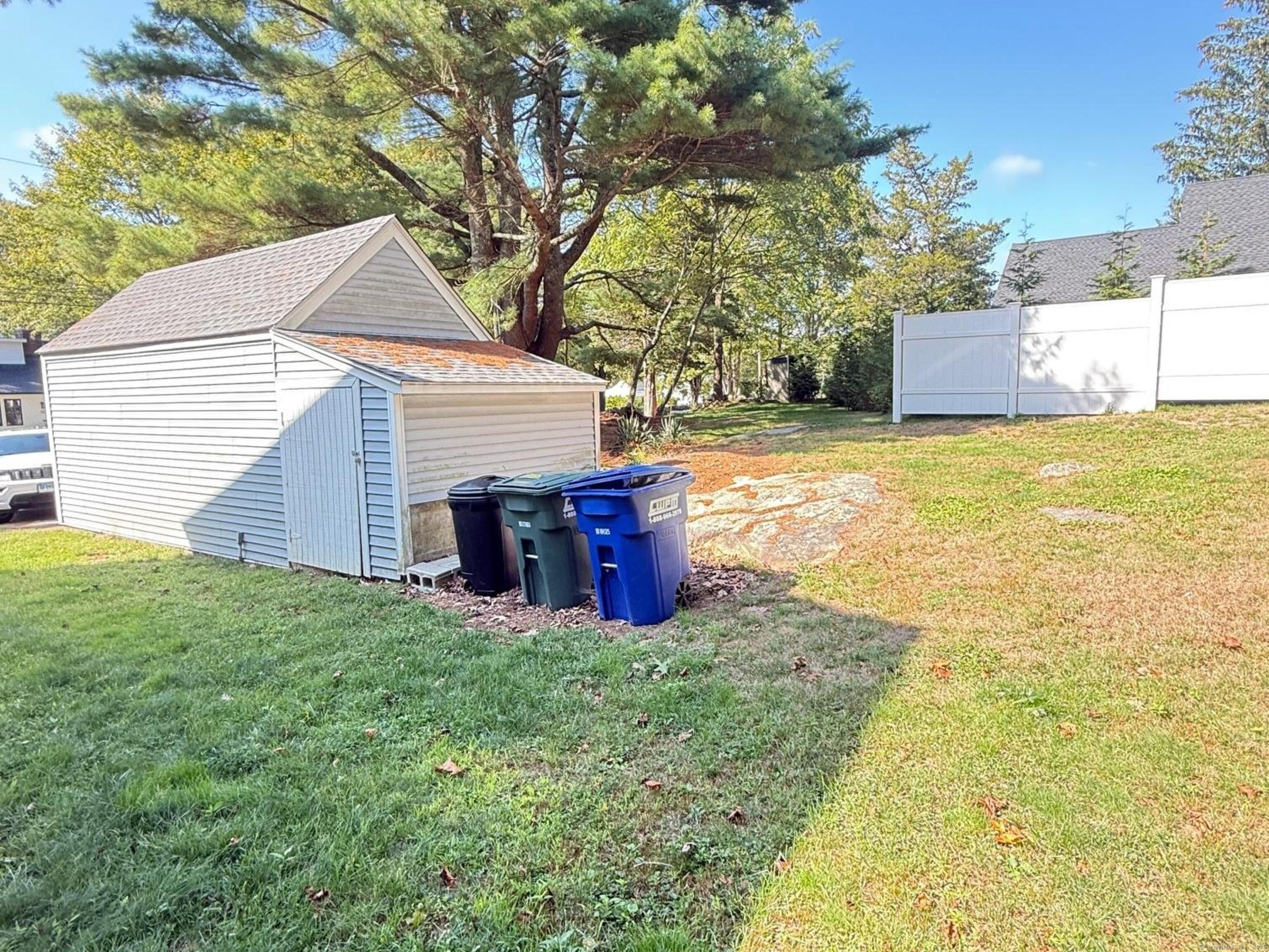 152 Hewitt Road Stonington, CT 06355 - Photo 33 of 34 a view of a house with a yard and tree s
