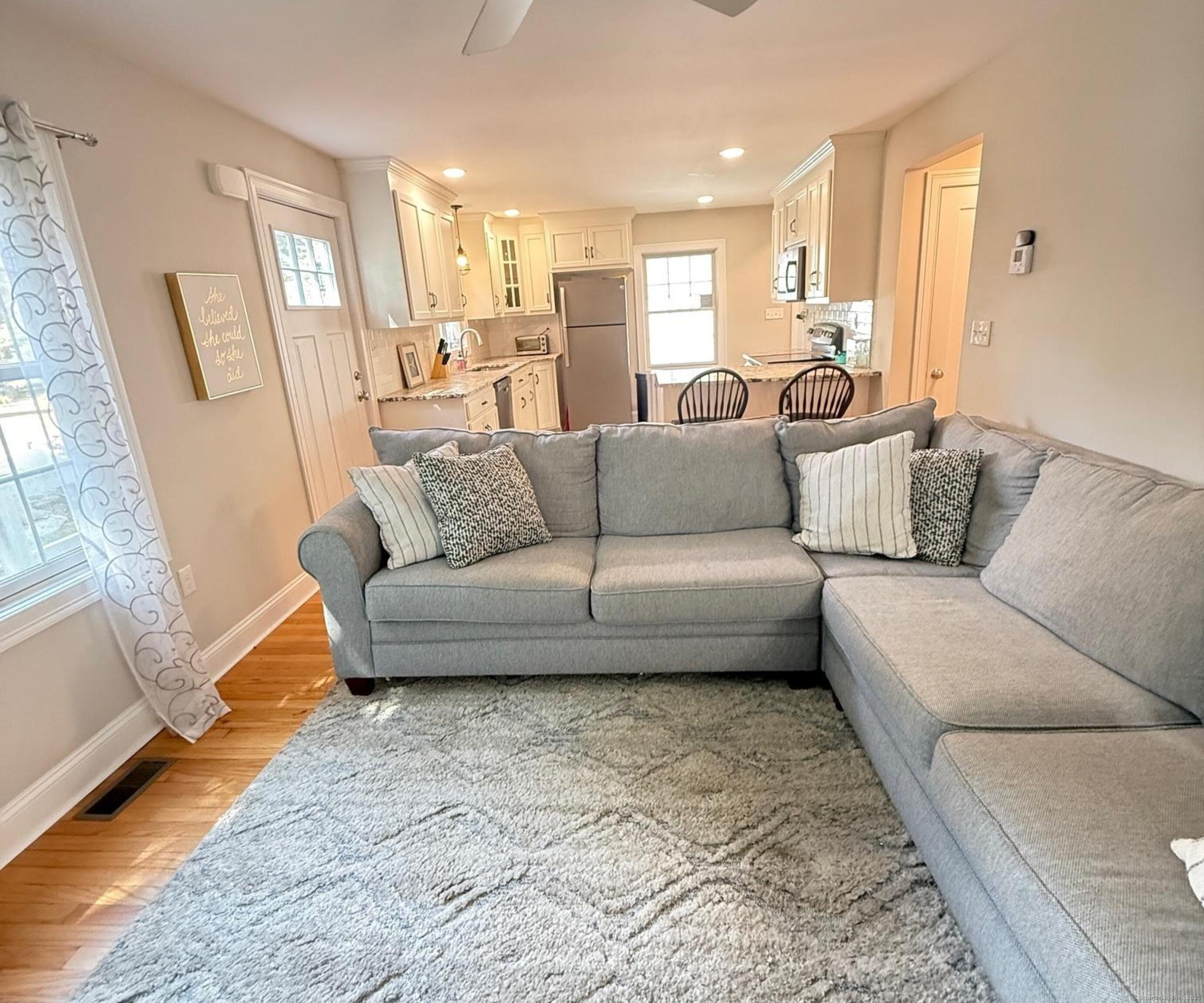 152 Hewitt Road Stonington, CT 06355 - Photo 5 of 34 a living room with furniture and a couch