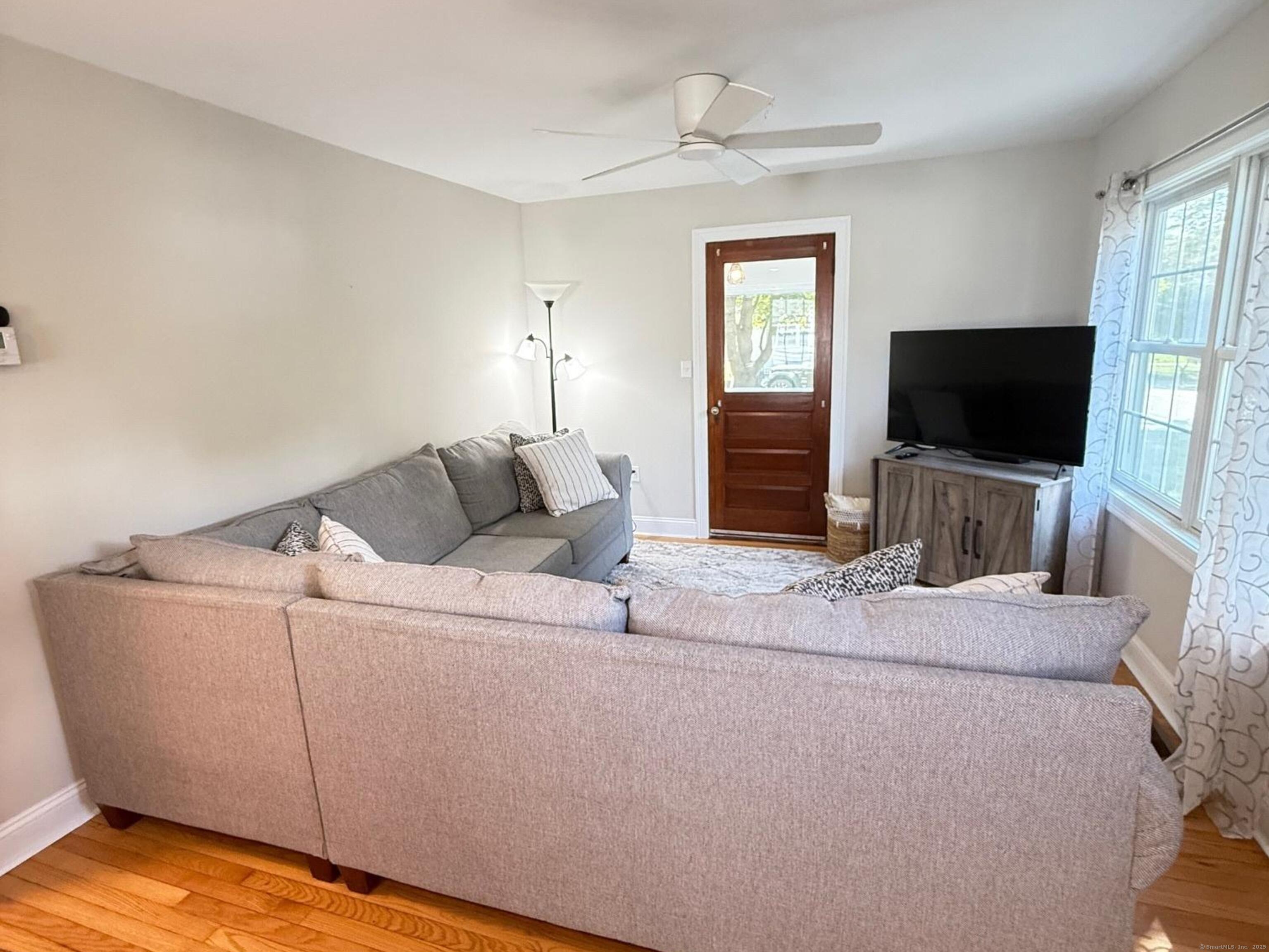 152 Hewitt Road Stonington, CT 06355 - Photo 7 of 34 a living room with furniture and a flat screen tv