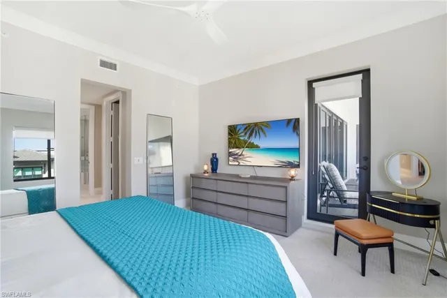 a bedroom with a bed and furniture