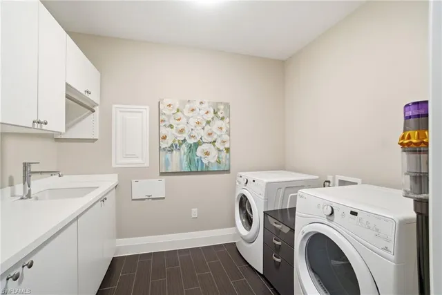 a utility room with dryer and washer