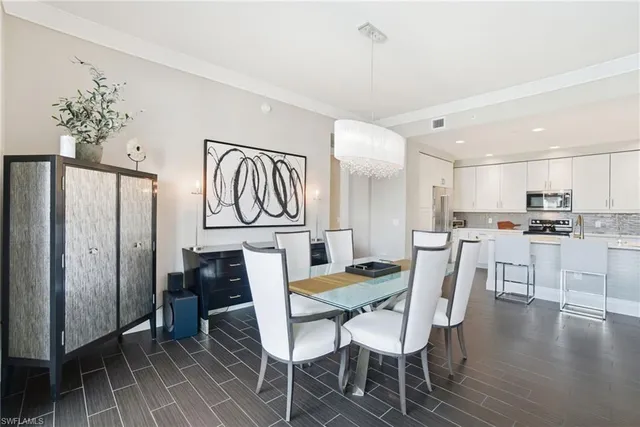 a view of a dining room with furniture wooden floor and a rug
