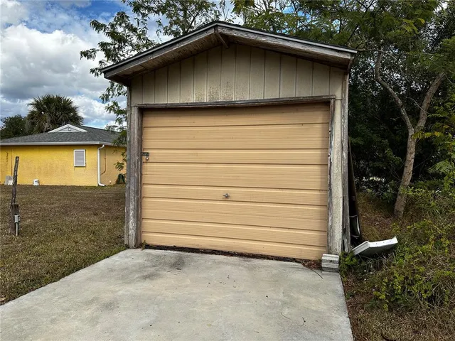a side view of a house with a garage