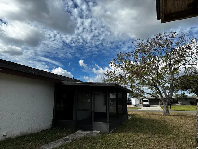 a view of a backyard of the house